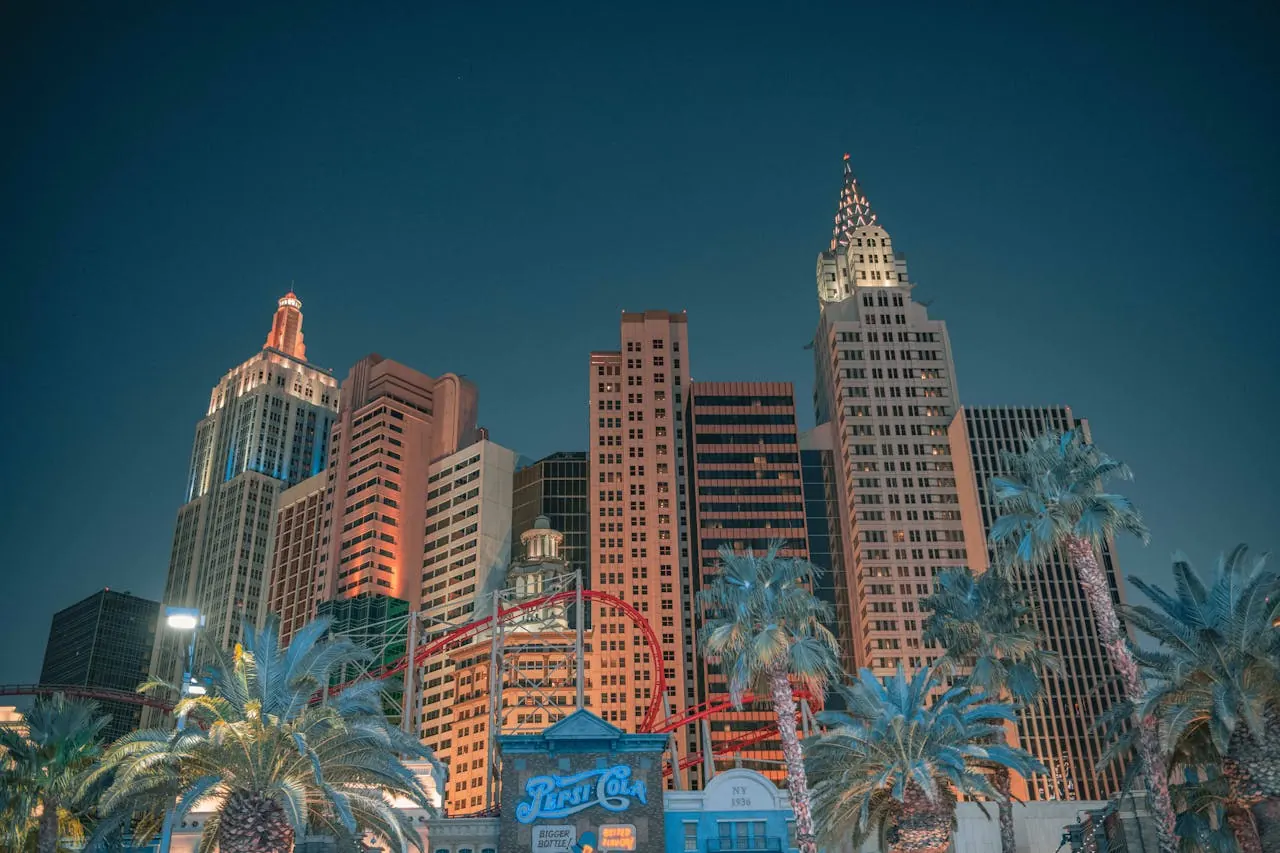 Cluster of casino resort towers silhouetted against a dusk sky