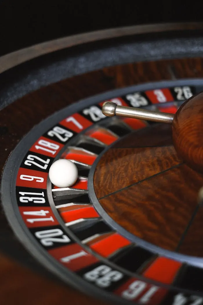 Close-up of a roulette wheel with the ball resting in a pocket